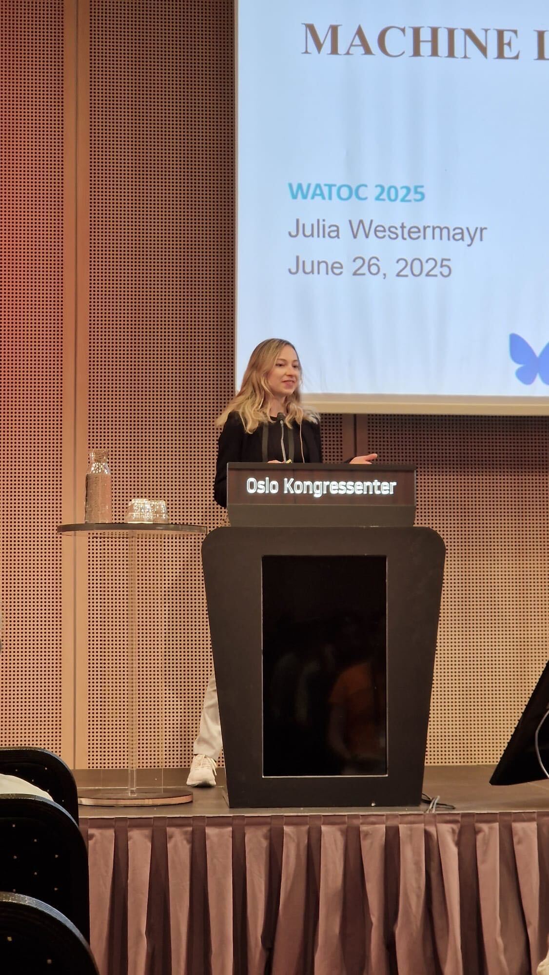 Photo. Jun.-Prof. Dr. Julia Westermayr presenting her research at WATOC conference 2025.