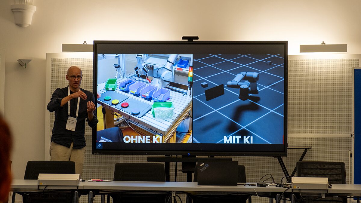 Photo. Alexander Hoffmann giving a talk at the ScaDS.AI Meetup x Data Week 2025.