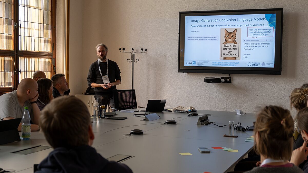 Photo. Robert Haase talking to the participants of his workshop at Data Week 2025
