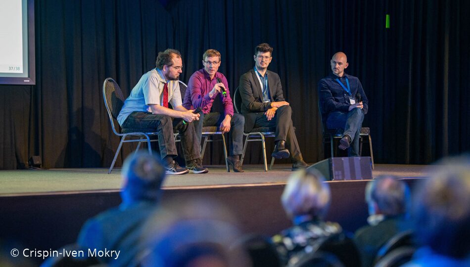 Photo. Florian Kieser, Prof. Julian Kunkel, Lasse Kohlmeyer and Laszlo Friedmann presenting the AI Service Centers. © Crispin-Iven Mokry