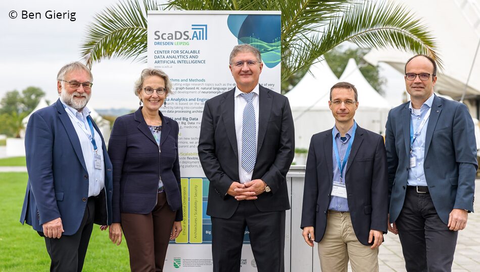 Photo. Prof. Dr. Wolfgang E. Nagel, Prof. Dr. Ursula M. Staudinger, Prof. Dr. Thomas Popp, Dr. René Jäkel and Prof. Dr. Lars Bernard photographed in front of the OSTRA-Dome at the All Hands Meeting of the German AI Community in 2024. © Ben Gierig