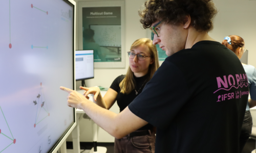 Photo. Neringa Jurenaite is showcasing the Mutlicut demonstrator to a student.