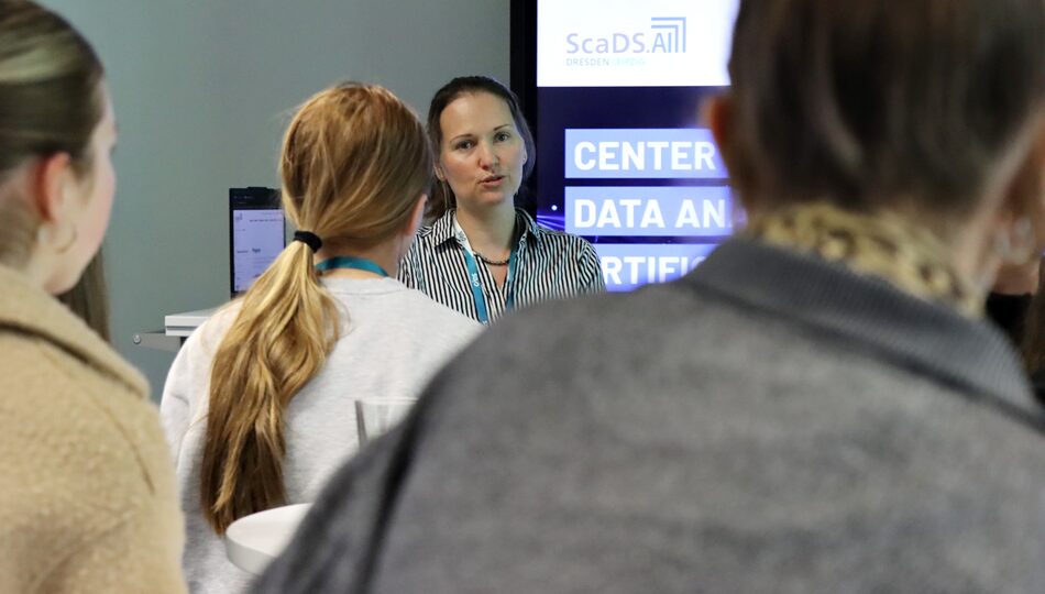 Photo. Dr. Iryna Okhrin is explaining demos at the Living Lab during Girls' Day 2026.