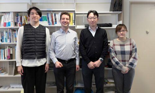 Photo. Prof. Michael Färber photographed together with a team from NII.