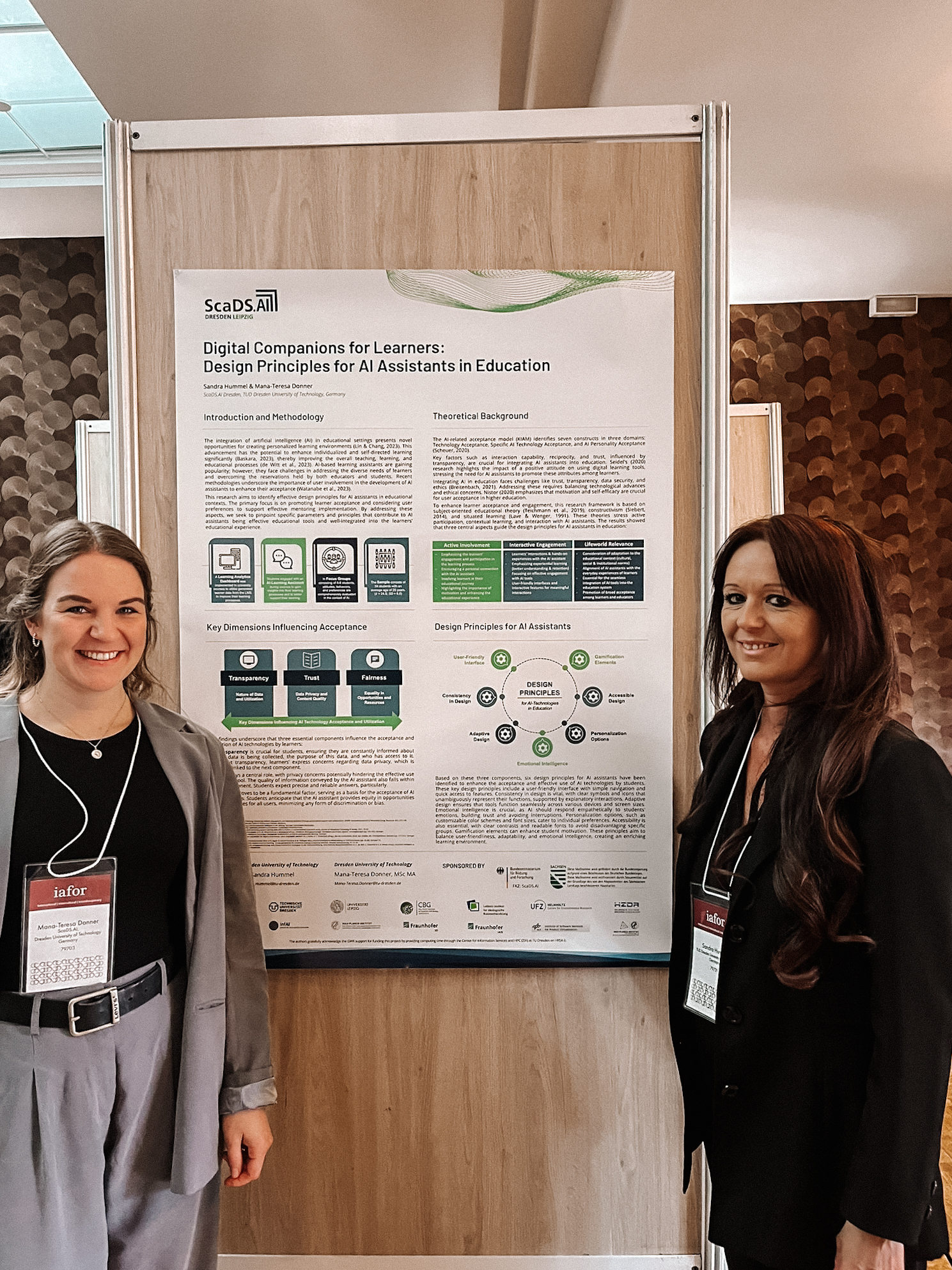 Photo. Dr. Sandra Hummel and Mana-Teresa Donner presenting their poster at the Paris Conference on Education 2024.