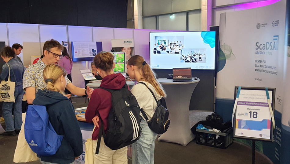 Photo. Dr. Thomas Burghardt welcoming pupils at the ScaDS.AI Dresden/Leipzig booth at forum sachsen digital 2024.