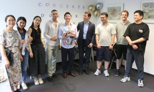 Photo. Dr. Shuzhou Yuan and Prof. Michael Färber are photographed together with friends after the successful defense of his PhD thesis.