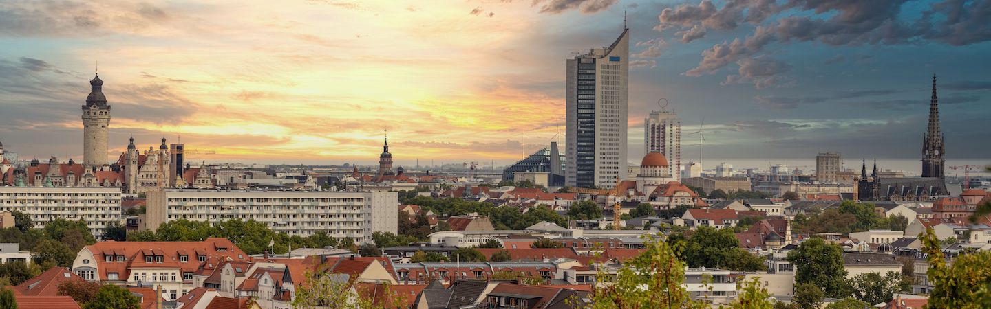 Photo. Panorama of the city of Leipzig, Saxony, with tall buildings, town hall and churches with an interesting colored sky.