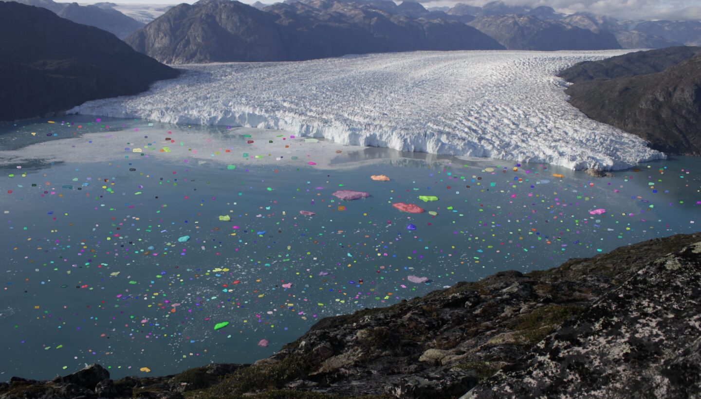 Tracked icebergs with segmented outlines in front of Eqalorutsit Kangilliit Sermiat glacier in Greenland
