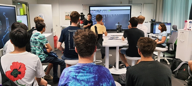 Pupils visiting the ScaDS.AI Living Lab in Dresden for Summer University at TU Dresden.